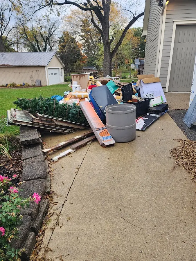 Dumpster being loaded with debris for 3 Yard Dumpster Rental in Malvern